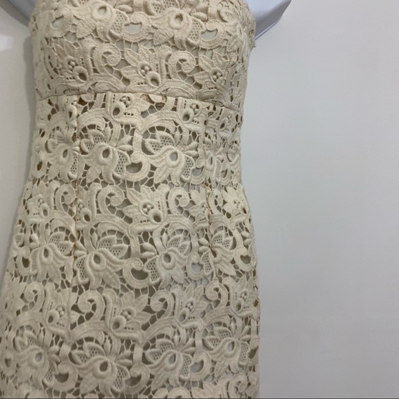 Ivory lace dress by Michael Kors is in like new condition. Size 2 - Picture 6 of 16